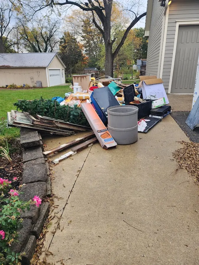 Dumpster being loaded with debris for Estate Cleanout Dumpster Rental in Villa Park